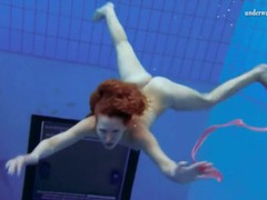 UhAnal presents: Curly hair redhead swims and looks sexy