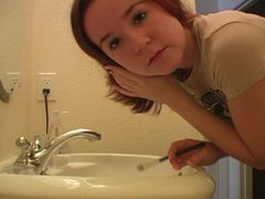 UhAnal presents: Redhead in tee shirt does her makeup