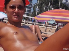 UhAnal presents: Small tits girl with a great tan is topless at the beach