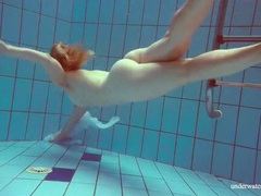 UhAnal presents: Redhead goes for a nude swim in the pool
