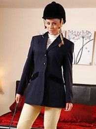 UhAnal presents: Clare R seductifvely removes her riding gear leaving on only opaque hold ups and sheer underwear