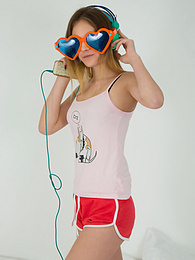 UhAnal presents: This doll really knows how to have fun with her and how she can show off her pussy and listen to some beats at the same time.